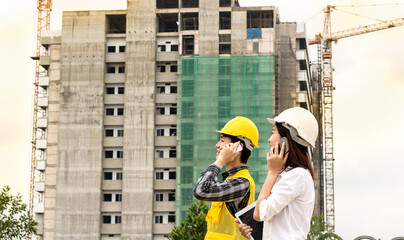 engineer or foreman using smart phone in her job with in construcktion site