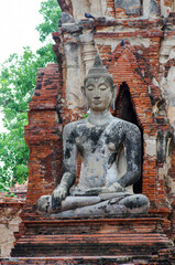 AYUTTHAYA, THAILAND - August, 2016: Stone statue of a Buddha in Ayutthaya, Thailand