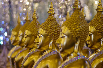 UTHAI THANI PROVINCE, THAILAND - August, 2016: Golden Buddha statue at Cathedral glass, Wat Tha Sung or Wat Chantharam