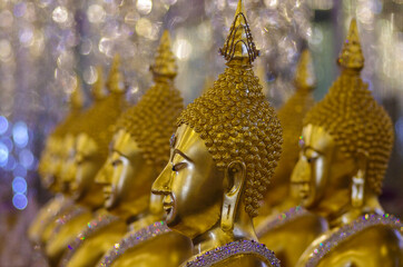 UTHAI THANI PROVINCE, THAILAND - August, 2016: Golden Buddha statue at Cathedral glass, Wat Tha Sung or Wat Chantharam