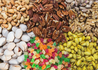 Abundance of a variety of nuts. Cashew, pistachios, marmalade, walnuts, pecans - a healthy food rich in proteins.