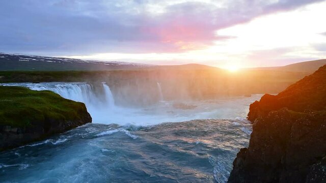 Fantastic sunset. Hodafoss very beautiful Icelandic waterfall 12 meters high. It is located in the north near Lake Myvatn.