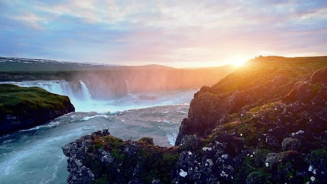 Fantastic sunset. Hodafoss very beautiful Icelandic waterfall 12 meters high. It is located in the north near Lake Myvatn.