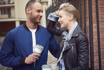 Couple drinking coffee on the streets .