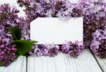 Lilac flowers with empty tag
