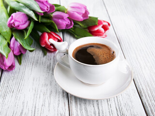 cup of coffee with tulips