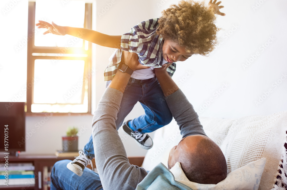 Wall mural Father playing with son