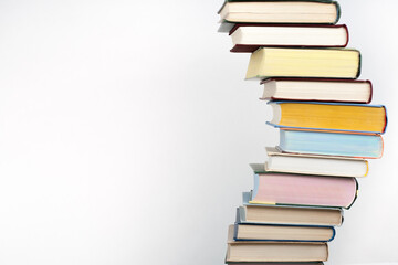 Open book, stacking, hardback books on wooden table and background. Back to school. Copy space for text,