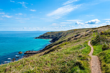 North Cornwall Coast near St Ives. Looking east along the coast path towards Pen Enys Point and...
