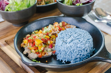 Food healthy, garlic pork with blue rice, blue color made from butterfly pea (Blue Pea).