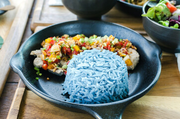 food healthy, garlic pork with blue rice, blue color made from butterfly pea (Blue Pea).