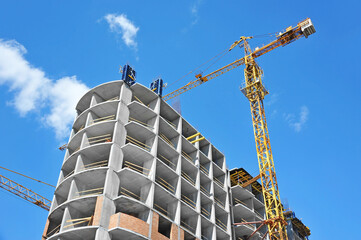 Crane and highrise construction site