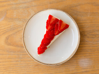 Strawberry Cheesecake on Wooden Table