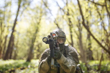 Fototapeta premium Russian soldier aiming in woods