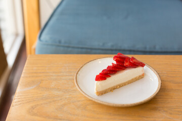 Strawberry Cheesecake on Wooden Table