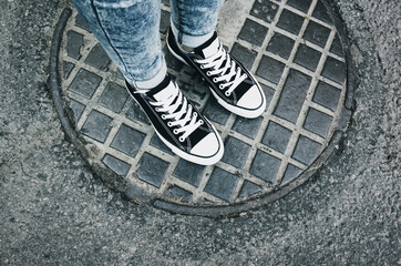 Teenager feet in sneakers. Gumshoes
