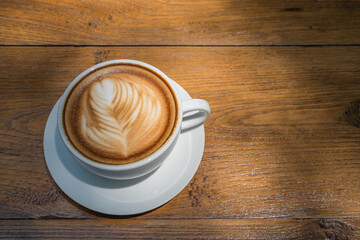 white coffee cup on wood table, coffee time
