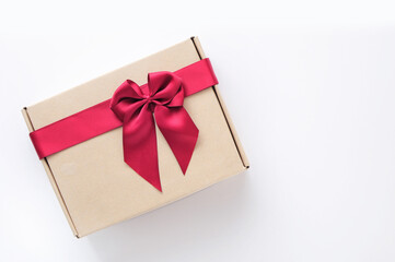 Top view of vintage gift box with red ribbon on white background, holiday and event concept. Copy space for text