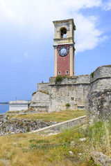 Fototapeta na wymiar The view of clock tower in old Byzantine fortress in Kerkyra, Corfu island in Greece.