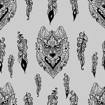 Seamless pattern with wolf and feathers