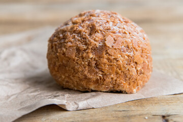 Small brown cake in shape of ball