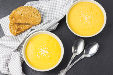  Vegetarian creamy butternut squash soup with sesame seeds.  Top view.