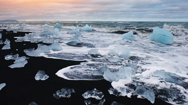 Jokulsarlon glacier lagoon fantastic sunset on the black beach, Iceland.