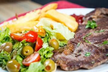 juicy steak beef meat with tomato and french fries