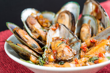 Mussel with white wine sauce on table