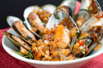 Mussel with white wine sauce on table