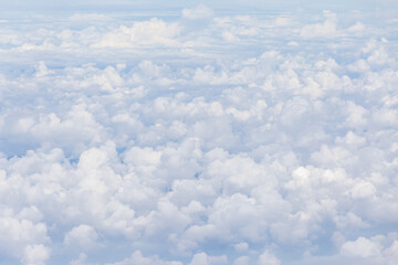 Beautiful cloudscape, on the heaven view over white fluffy clouds, freedom concept.