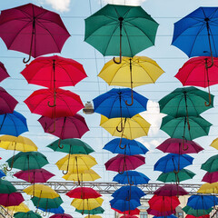 Colorful umbrellas background. Colorful umbrellas in the sky. Street decoration.