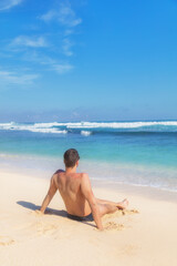Obraz premium Man enjoying on empty tropical exotic beach.