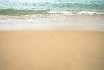 Fototapeta na wymiar Sand beach and sea water with sunlight reflect