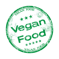 Green grunge rubber stamp with the text vegan food written inside the stamp