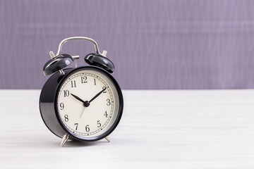 Vintage clock on table