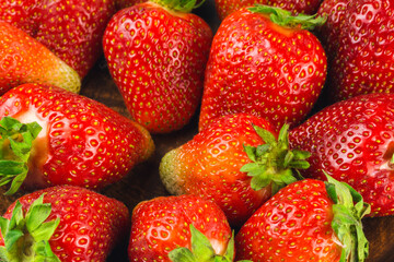 Harvest of fresh organic strawberries close-up view