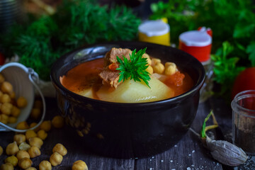 Tomato soup with beef, vegetables and chickpeas