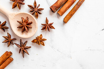 Flat lay vanilla, cinnamon, herb and spices on white kitchen background space for text