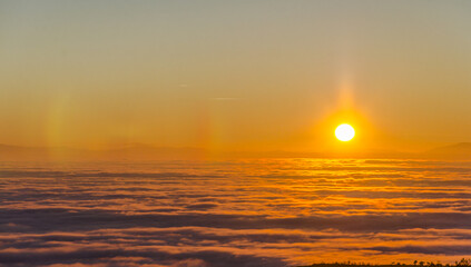 Big sun and Mist in sunrise, sunset on mountian morning, aerial