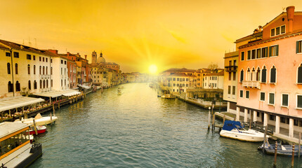Sunset view of Grand Canal with gondolas in Venice, Italy.