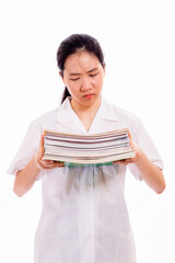 Chinese high school girl holding pile of books