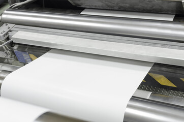 Detail of offset printing machine with roll of paper