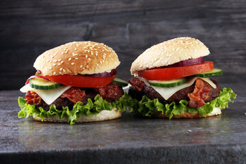 fresh tasty burger on wooden grey background