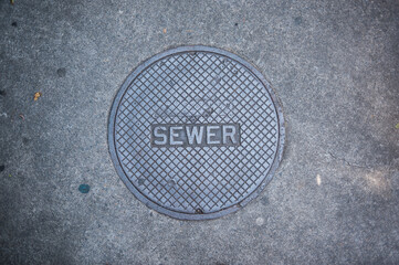 Sewer sidewalk cover - obrazy, fototapety, plakaty