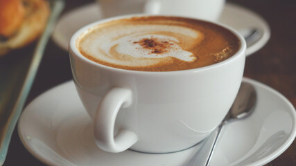 Cappuccino with a French roll for breakfast