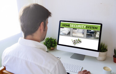 man viewing security cams on computer