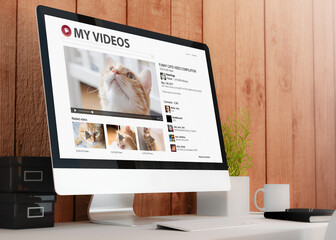 modern workspace with computer cat video streaming - obrazy, fototapety, plakaty
