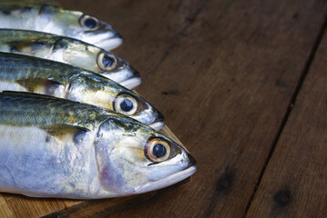 Mackerel Fish Over Wooden Background With Dramatic Light And Vignette Effect