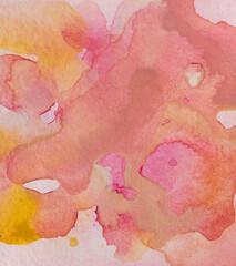Hand painted watercolor background in pink and yellow colors. Abstract watercolor stains on paper texture.
